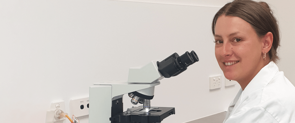 scientist with microscope 